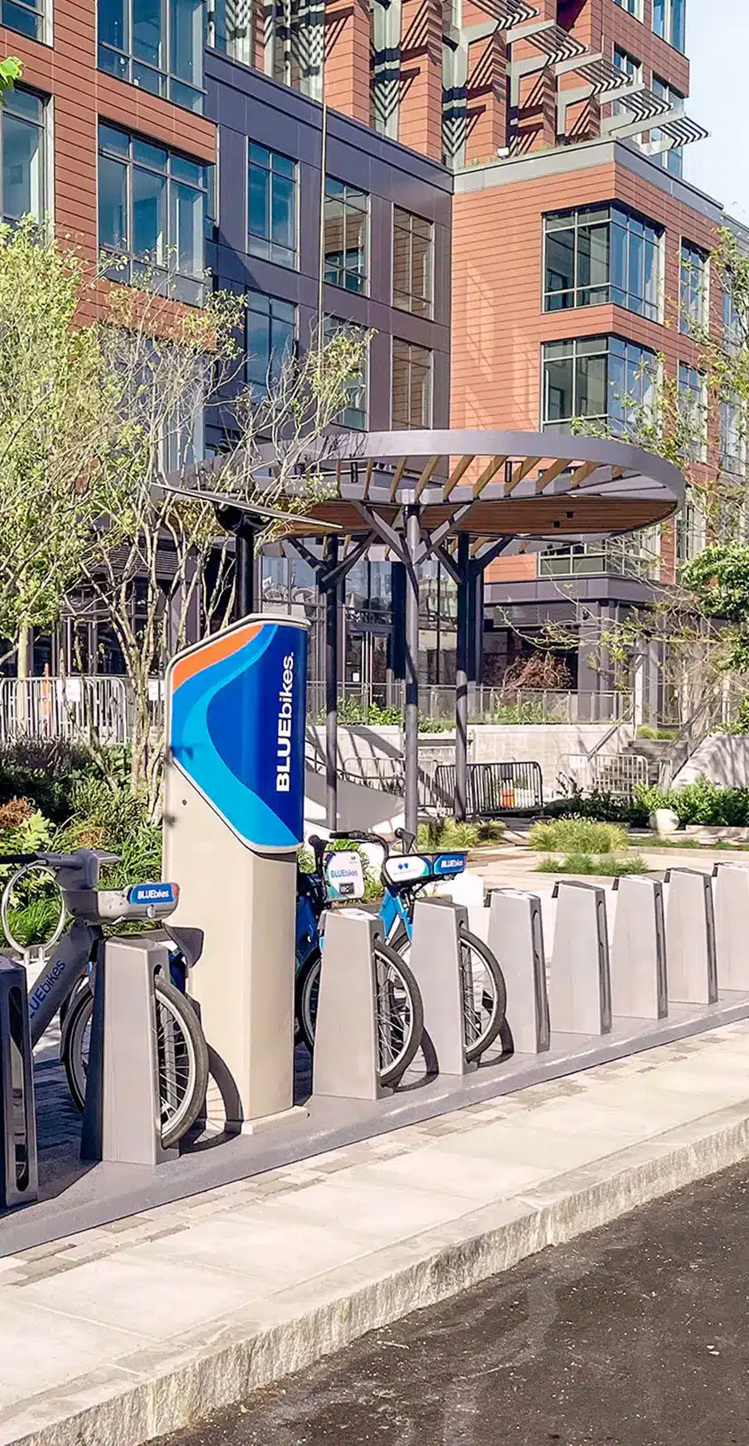 Bluebikes docking station outside the 40 Thorndike building, offering sustainable transportation options