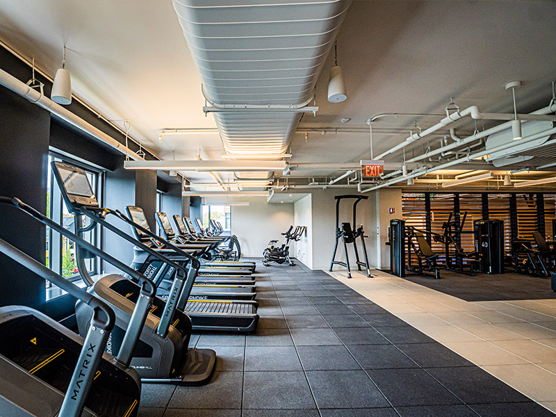 Modern fitness center at 40 Thorndike with gym equipment and people exercising
