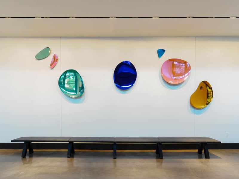 Colorful modern art displayed in the lobby of 40 Thorndike with seating area