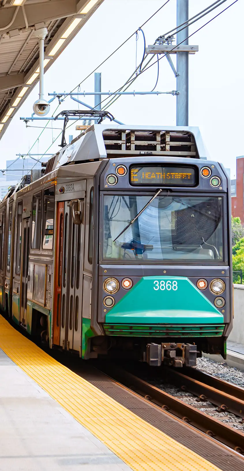 A green line subway train at a platform near the 40 Thorndike building in Cambridge