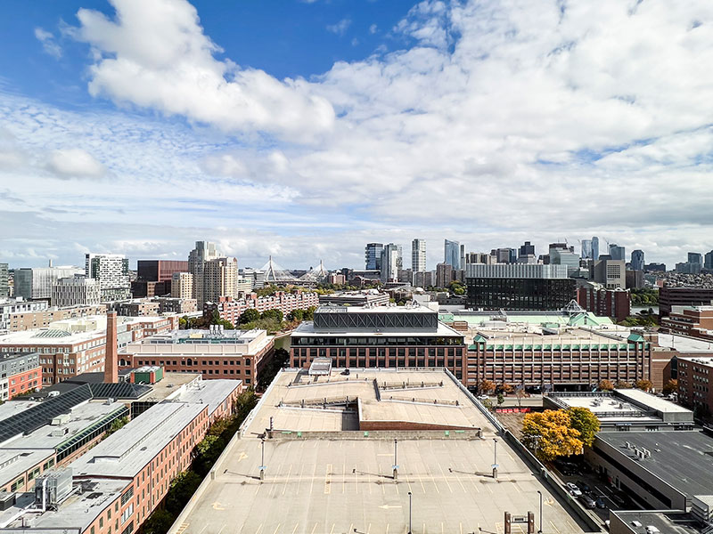 Eastward view from upper floors showcasing the expansive Cambridge skyline and industrial rooftops