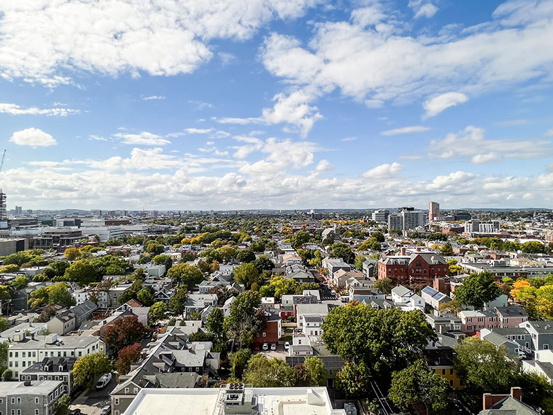 Expansive view of Cambridge Crossing from 40 Thorndike, with construction cranes and green spaces visible