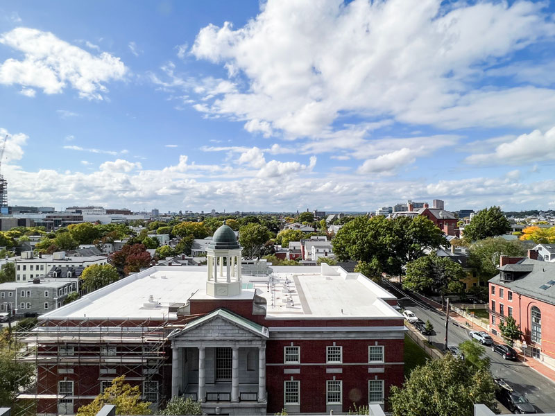 Rooftop view of Cambridge cityscape with a blend of industrial and modern buildings