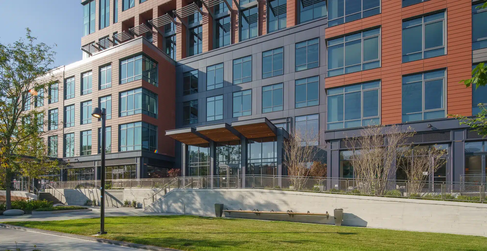 Street-level view of 40 Thorndike office building with glass facades and lush landscaping