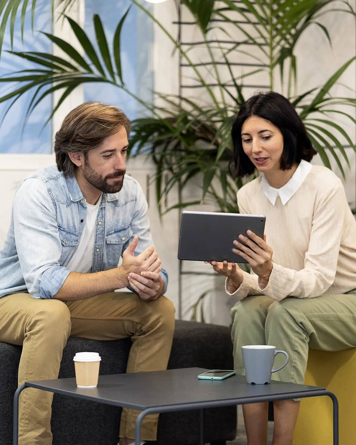 Co-workers enjoying a casual meeting and coffee at 40 Thorndike's innovative office space